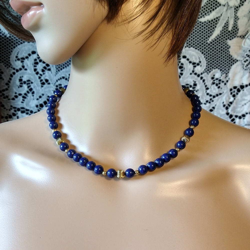 Navy blue and gold vintage necklace has sparkles in blue beads 16 inches long